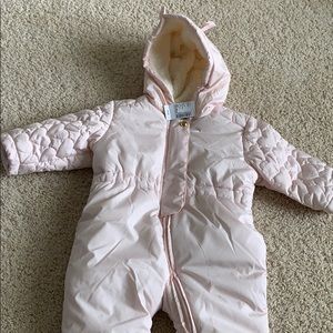 Children place snow suit